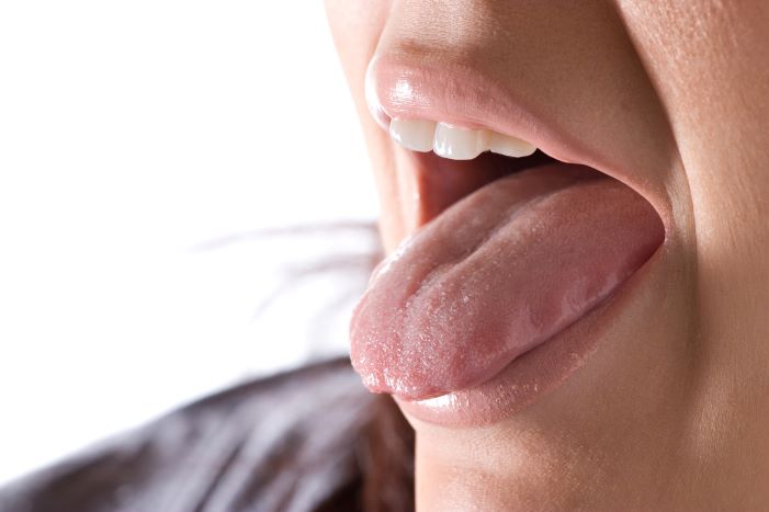 A woman sticking out her tongue